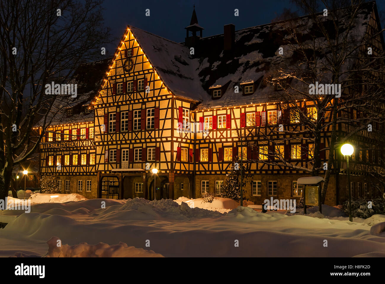Snowy timber-framed house in winter, here the townhall of the smalltown of Munsingen, Baden-Wurttemberg, Germany. Stock Photo