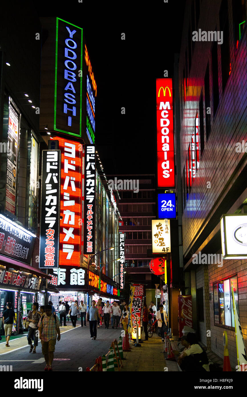 Tokyo, Japan. Neon signs on buildings in the Shinjuku district. Stock Photo