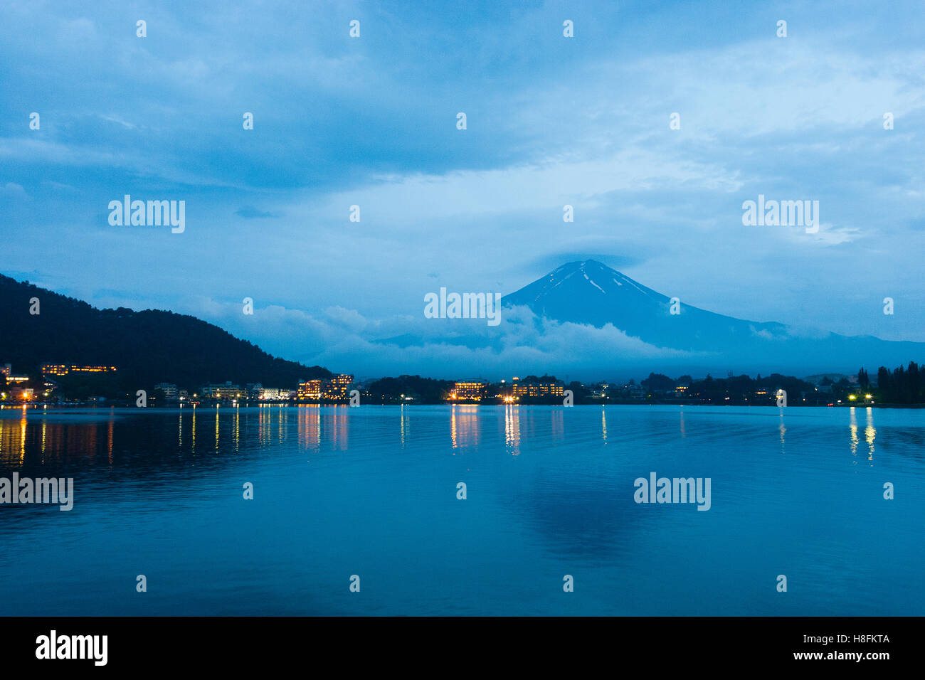 KAWAGUCHIKO, JAPAN A rare, cloud-free view of Mount Fuji at night, from across Lake Kawaguchi. Stock Photo