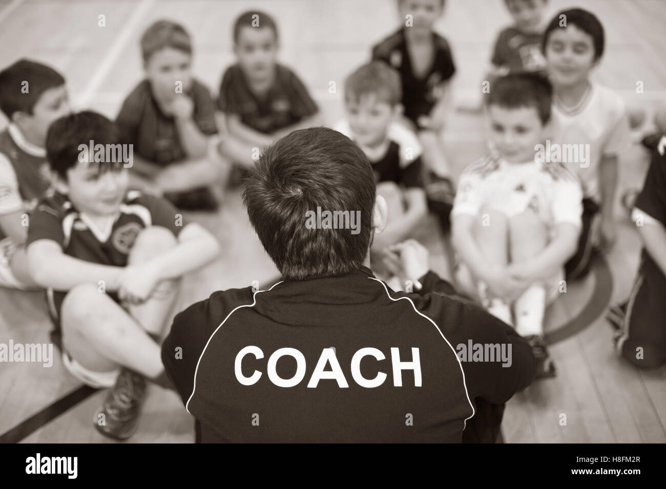 Kids football coaching indoors Stock Photo Alamy