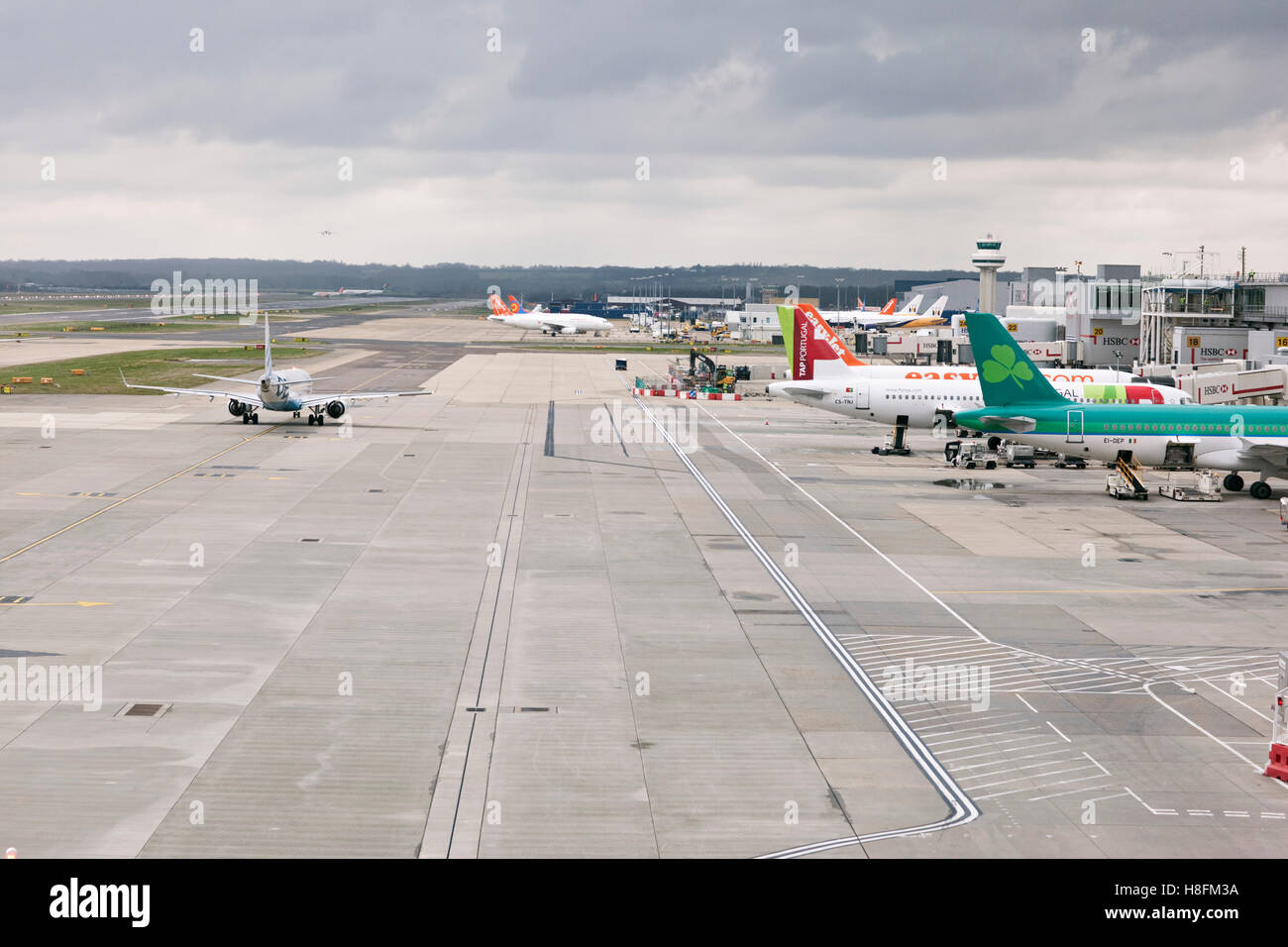 Planes parked at Gatwick airport departure gates Stock Photo Alamy