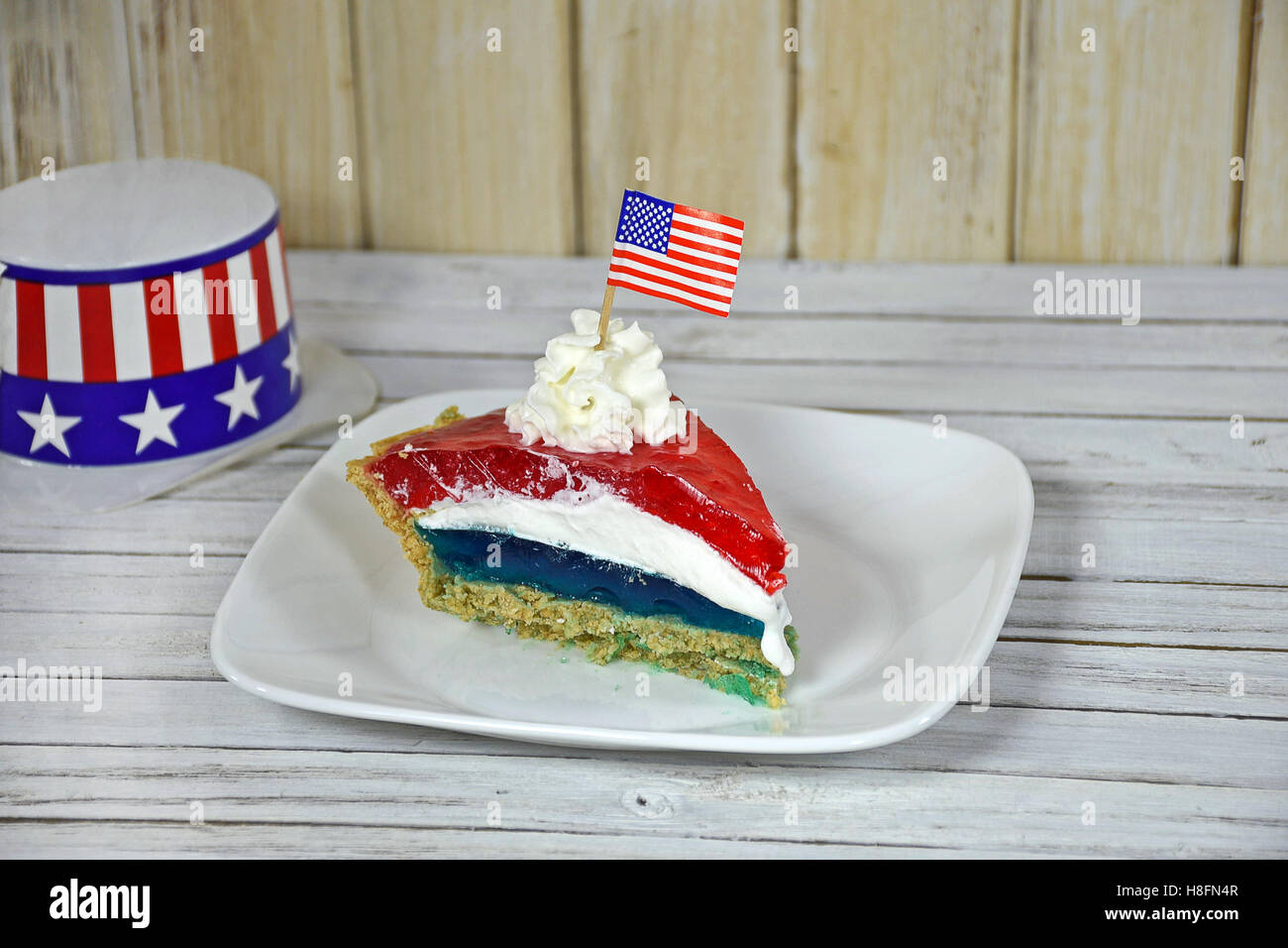 red and blue jello with whipped cream and American flag and hat Stock Photo