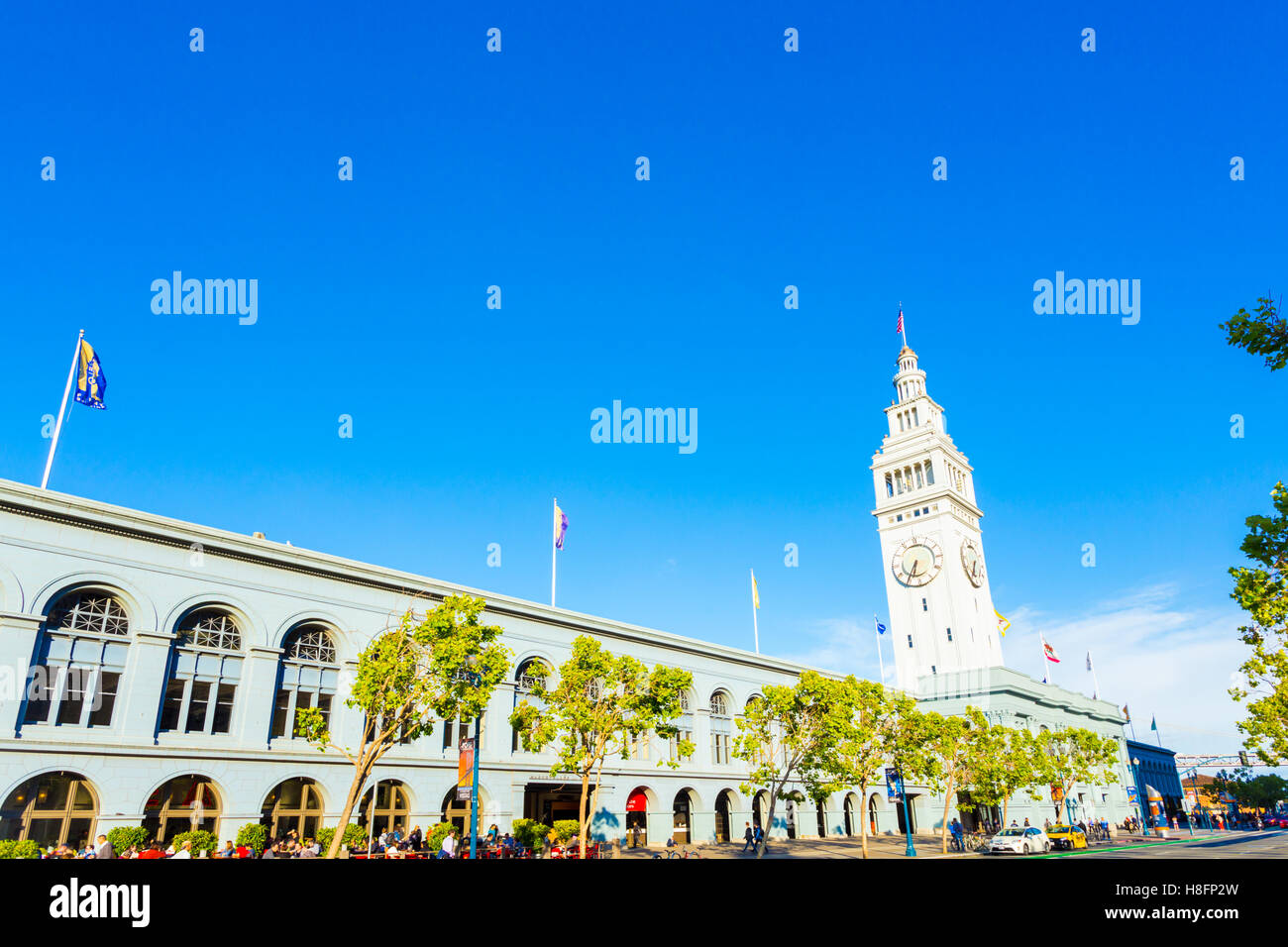 Historic Ferry Building angled against a beautiful blue sky on a sunny summer day in San Francisco, California. Horizontal Stock Photo