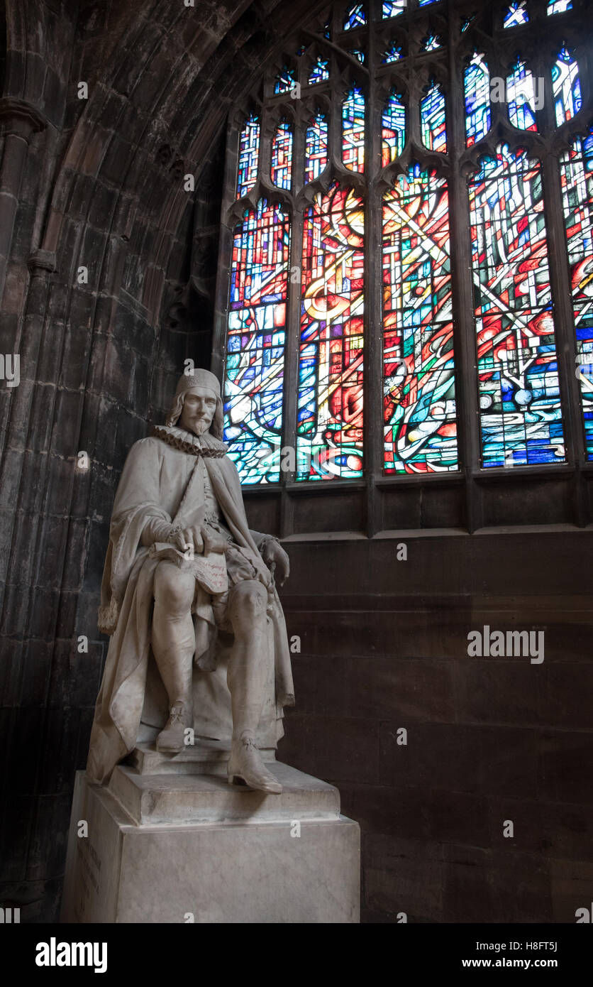 Chetham Statue of Humphrey Chetham and colorful stained glass window inside the ...