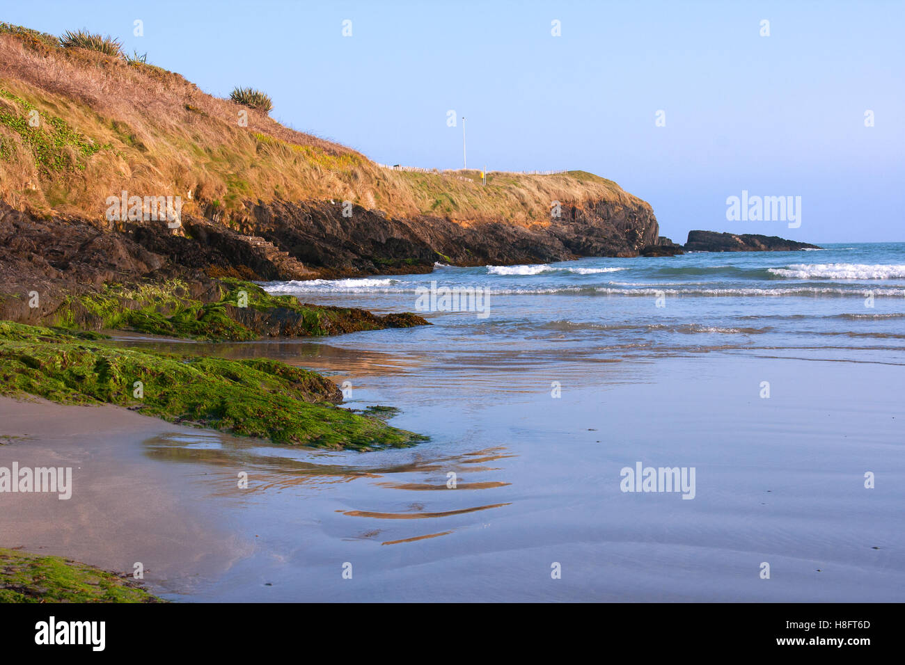Low tide in a sandy cove at Inchydoney beach in County Cork on the