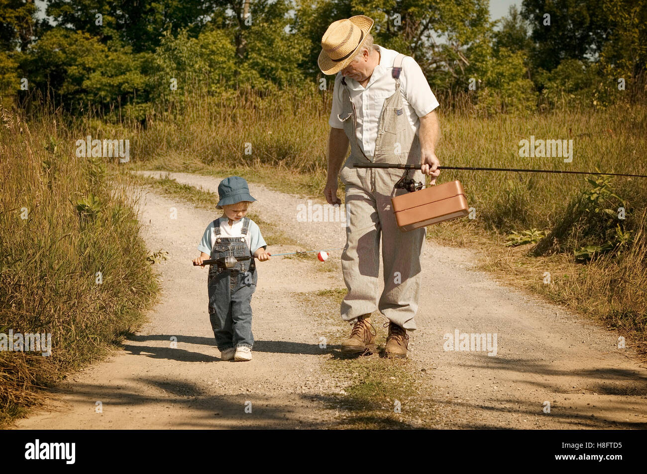 https://c8.alamy.com/comp/H8FTD5/grandfather-and-grandson-going-fishing-H8FTD5.jpg