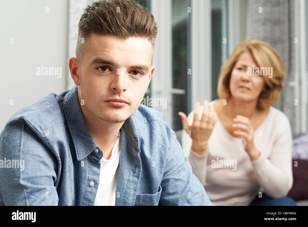 Mother Arguing With Teenage Son Stock Photo