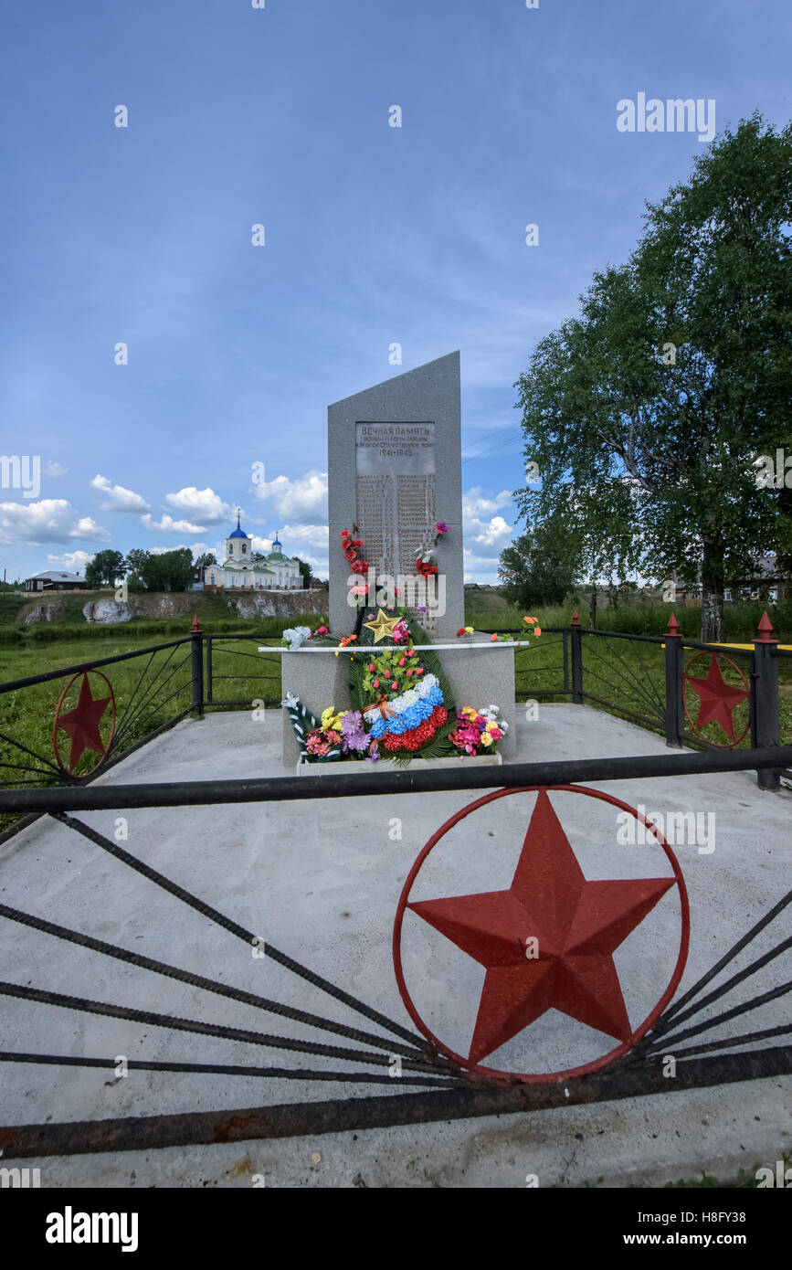 Memorial to soldiers from Sloboda of the Second World War with St. George's church at background, Sverdlovsk Oblast (Urals), Rus Stock Photo
