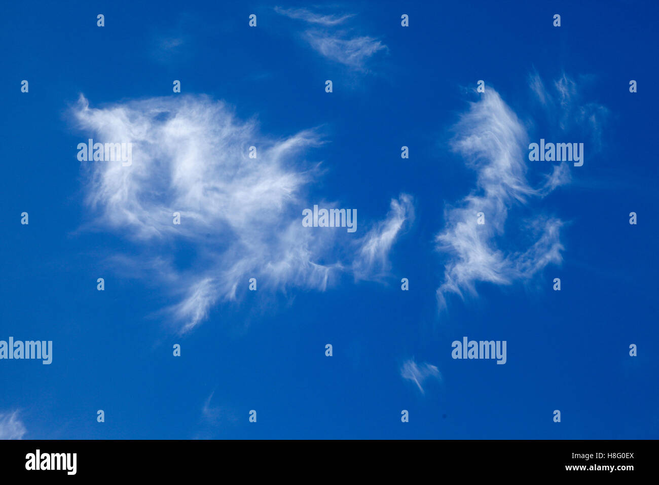 what shape can you see in these clouds looks like superman or an angle ...
