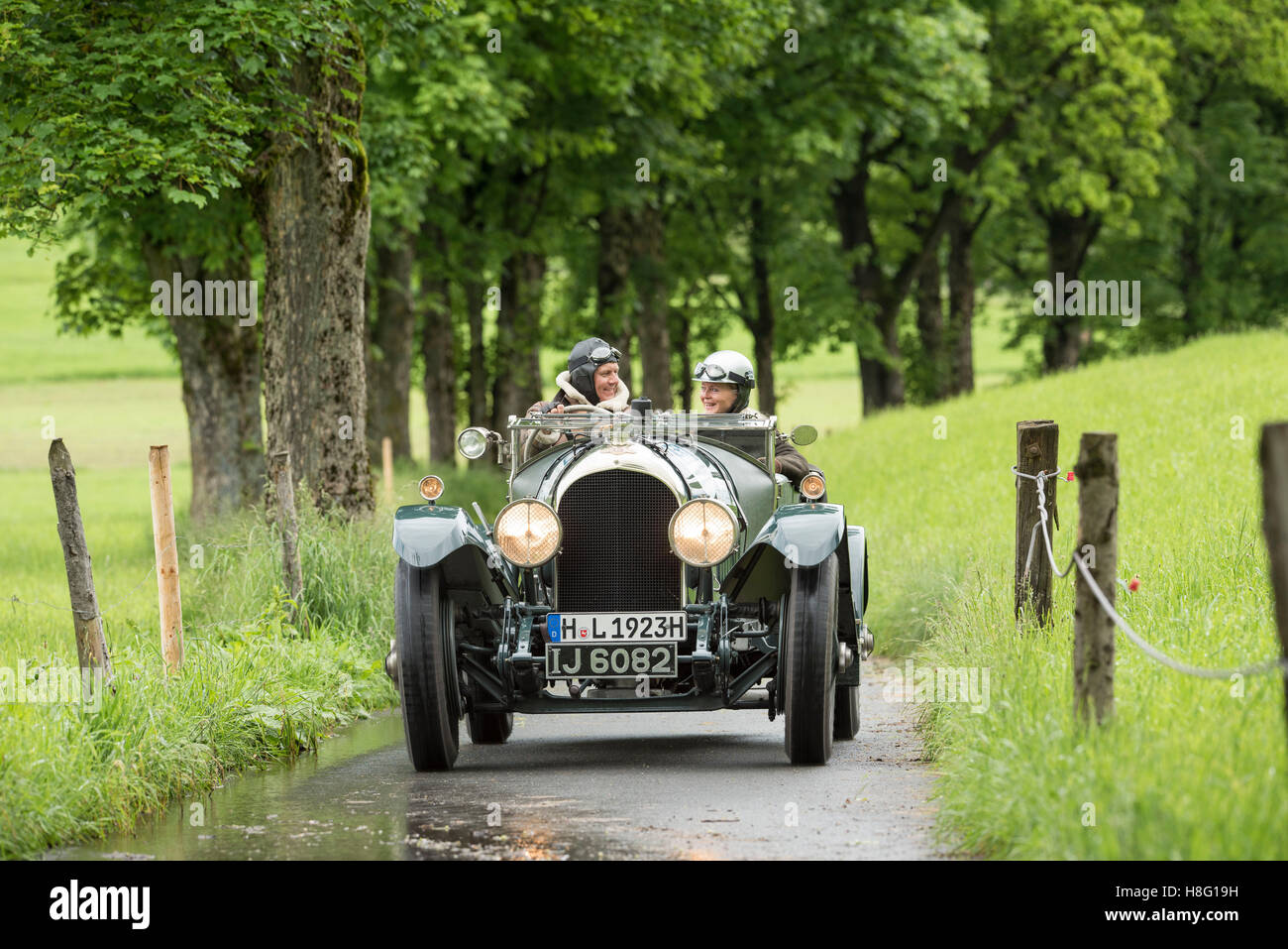 Couple in the classic car Stock Photo - Alamy