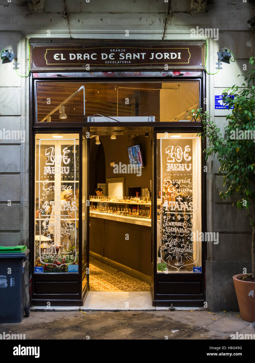 Store front of the chocolate shop 'El Drac de Sant Jordi' in Barcelona, Catalonia, Spain, at night. Stock Photo