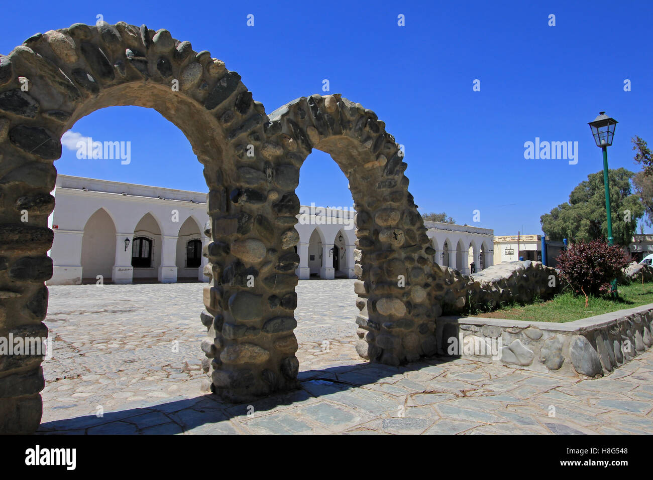 Arches behind main square, mountain village Cachi, Argentina Stock ...