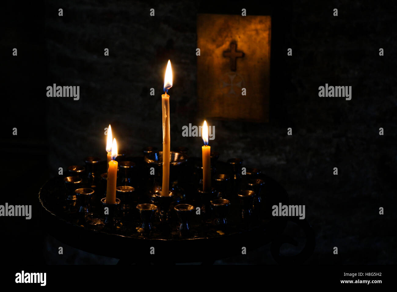Candles burning over dark background in a church Stock Photo - Alamy