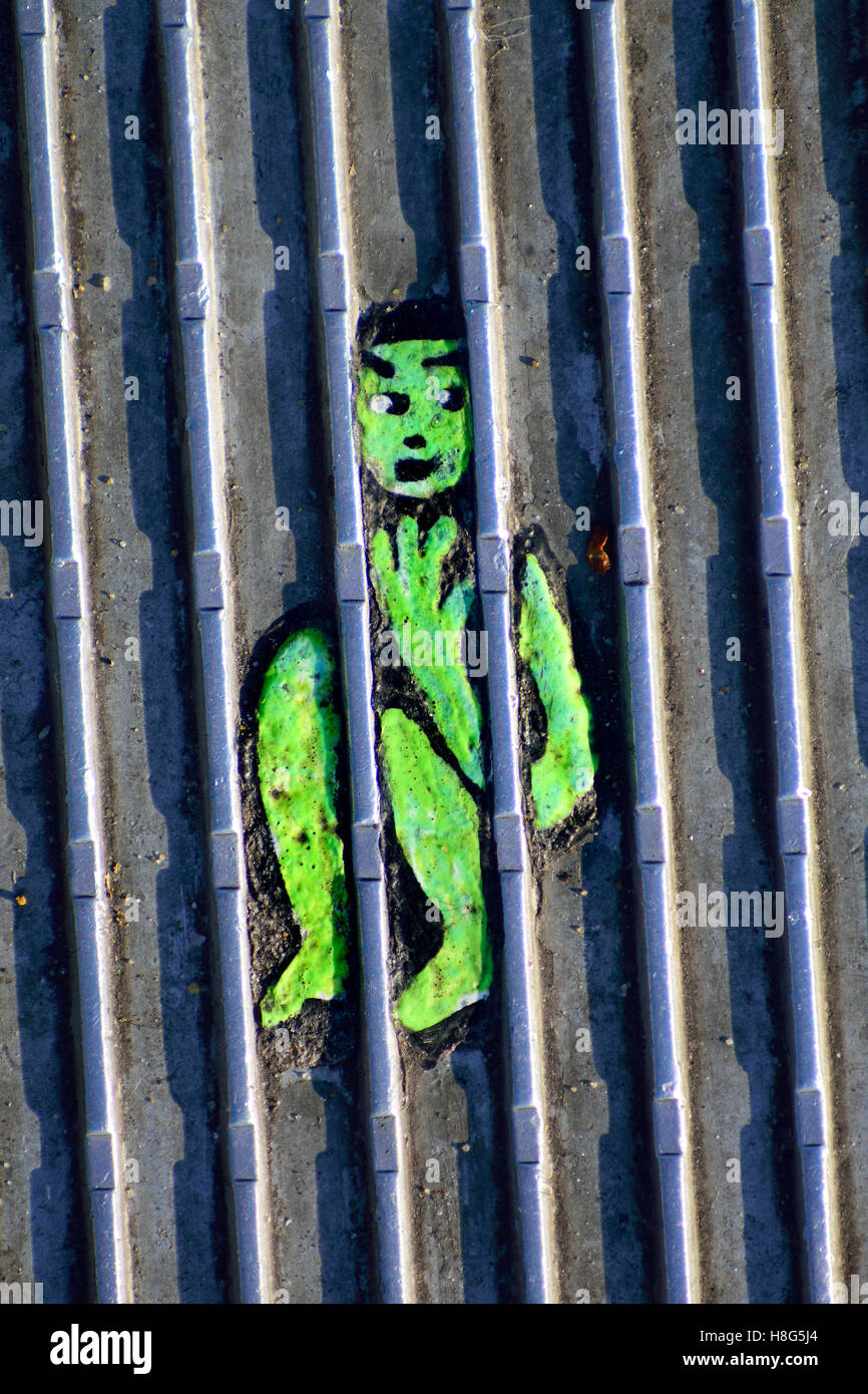 London, England, UK. Millennium Bridge: A work by Ben Wilson - 'Chewing Gum Man' . Painting on a piece of discarded chewing gum, Stock Photo