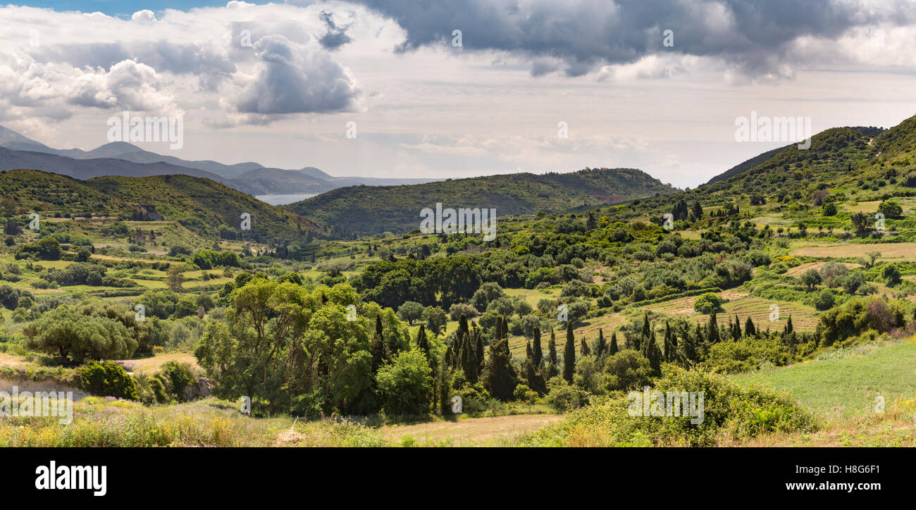 The landscape West of Kefalonia, Greece has beautiful green fields and rolling hills towards Argostoli Bay. Stock Photo
