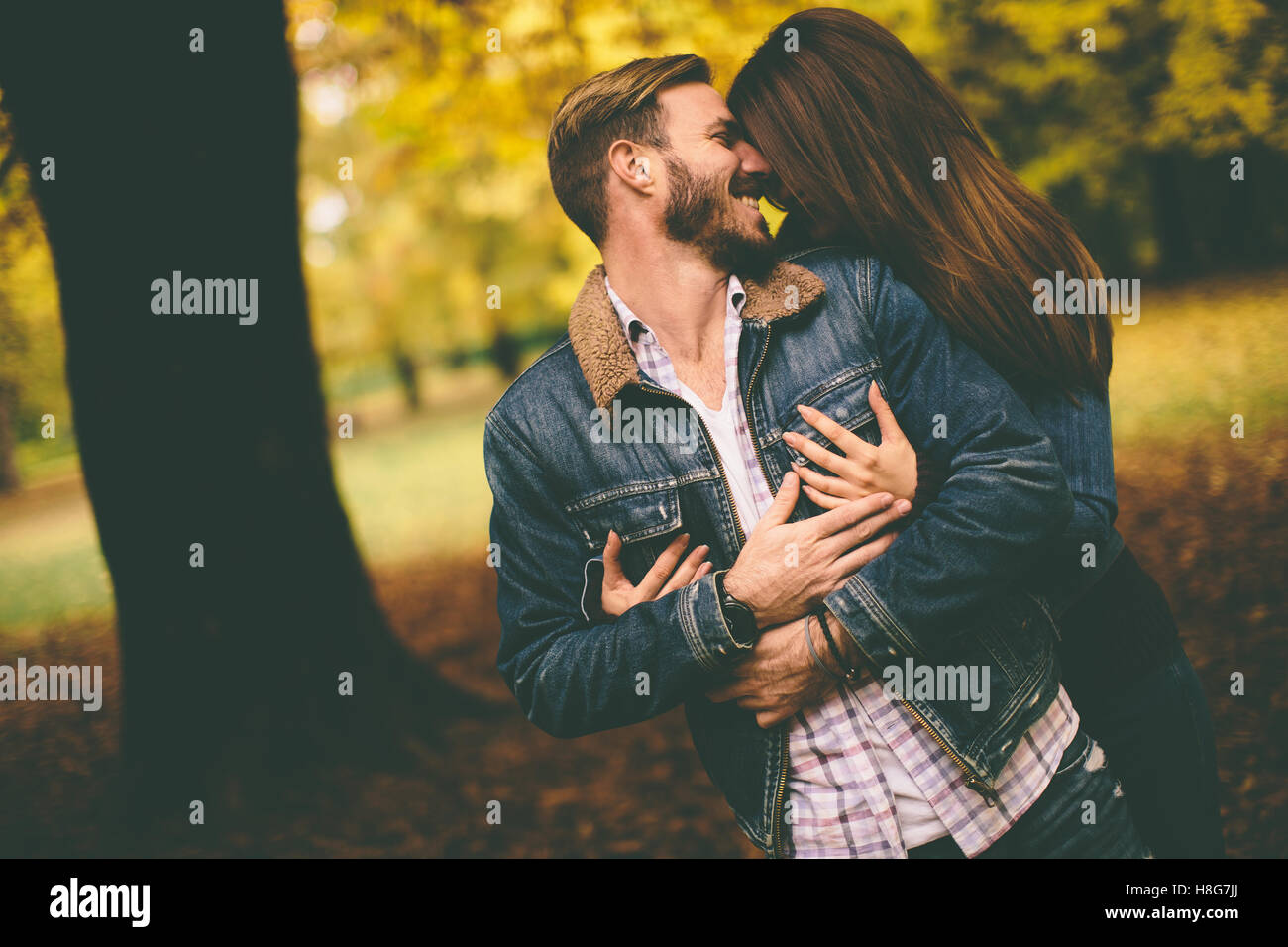 Loving couple in the autumn park Stock Photo - Alamy