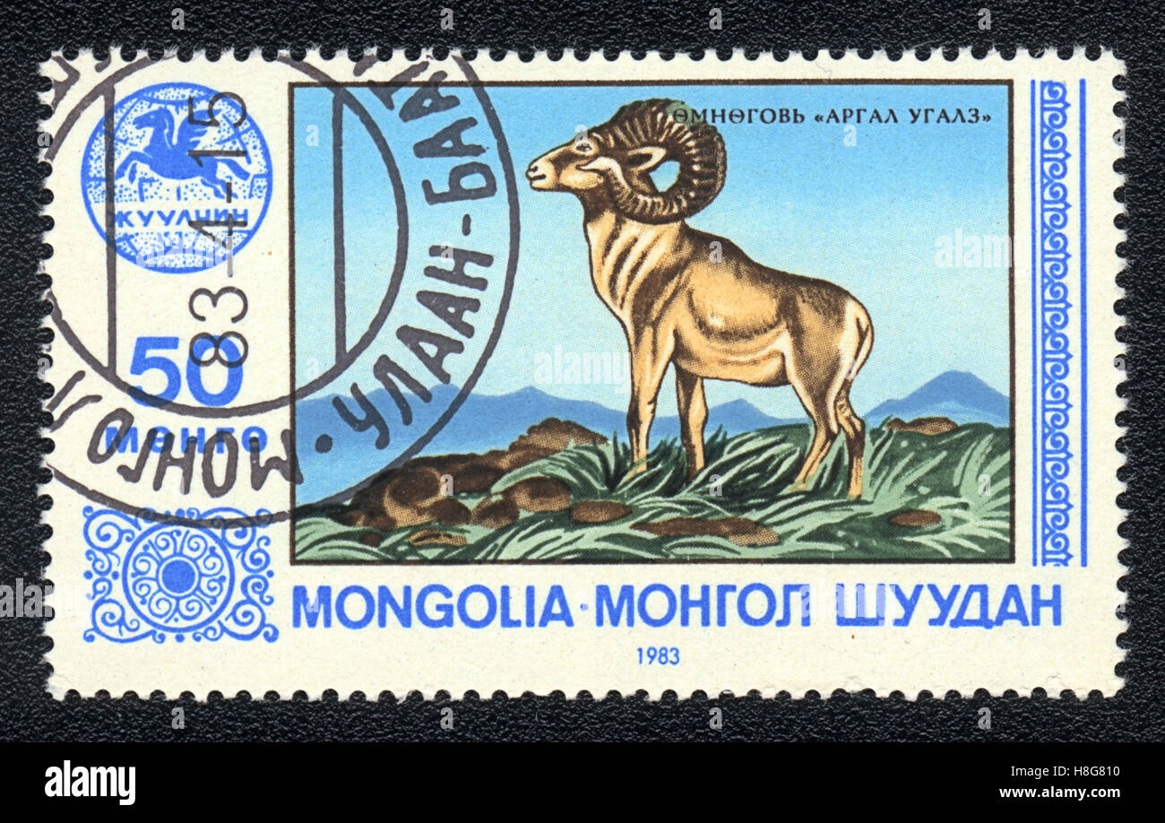 A postage stamp printed in  Mongolia (МОНГОЛ ШУУДАН) shows Wild sheep - Ovis Ammon Ammon, 1983 Stock Photo