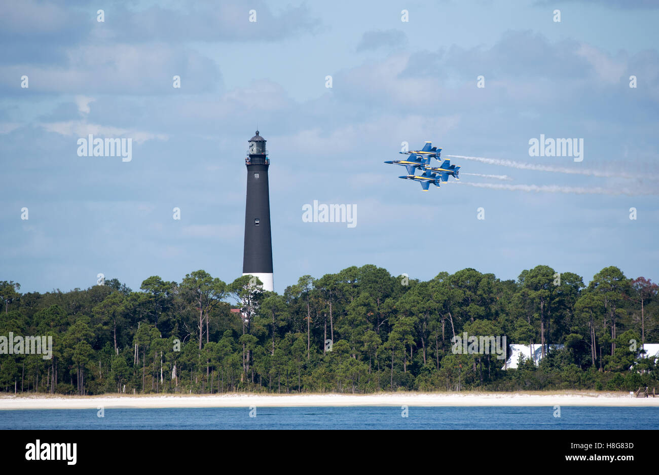 Pensacola Florida USA - Military jets flying in formation over Pensacola lighthouse and seen from Santa Rosa Island Stock Photo