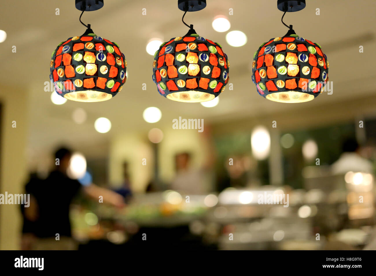 Warm lighting modern ceiling lamps in the cafe and interior decoration ...