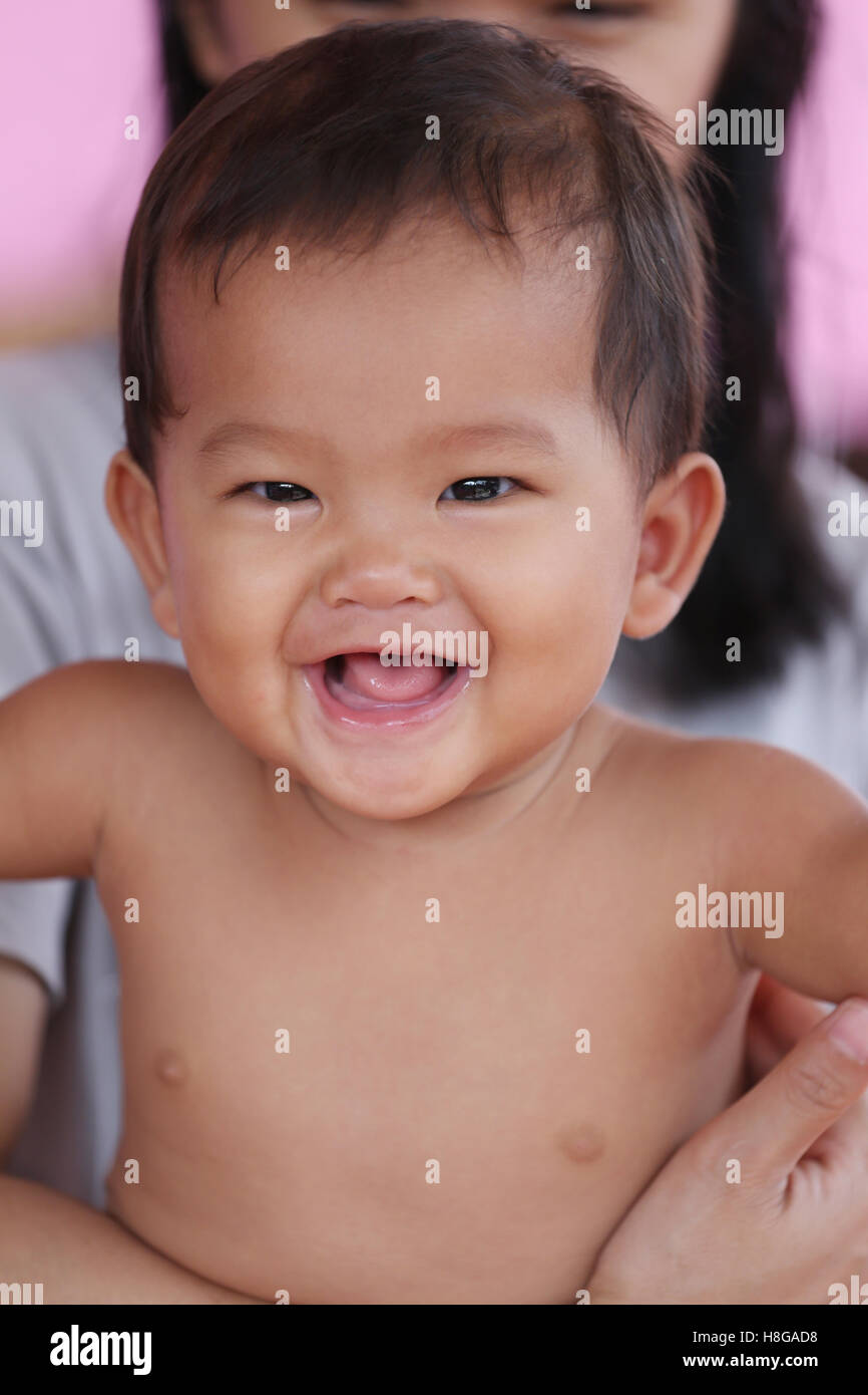 Asian baby smiling happily and good mood,concept of health and growth. Stock Photo