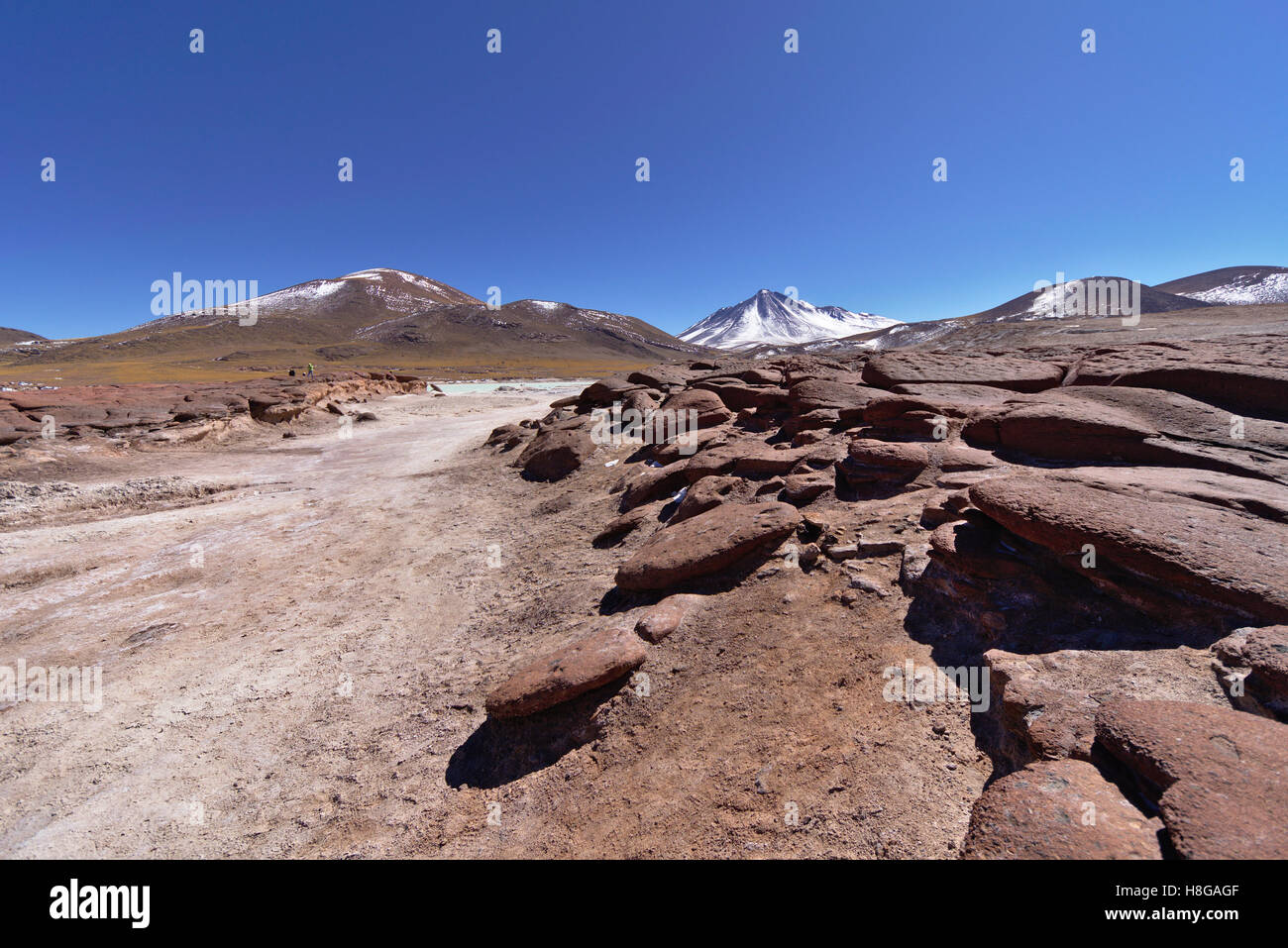 Underneath Red Rocks Red rocks under blue sky Stock Photo - Alamy