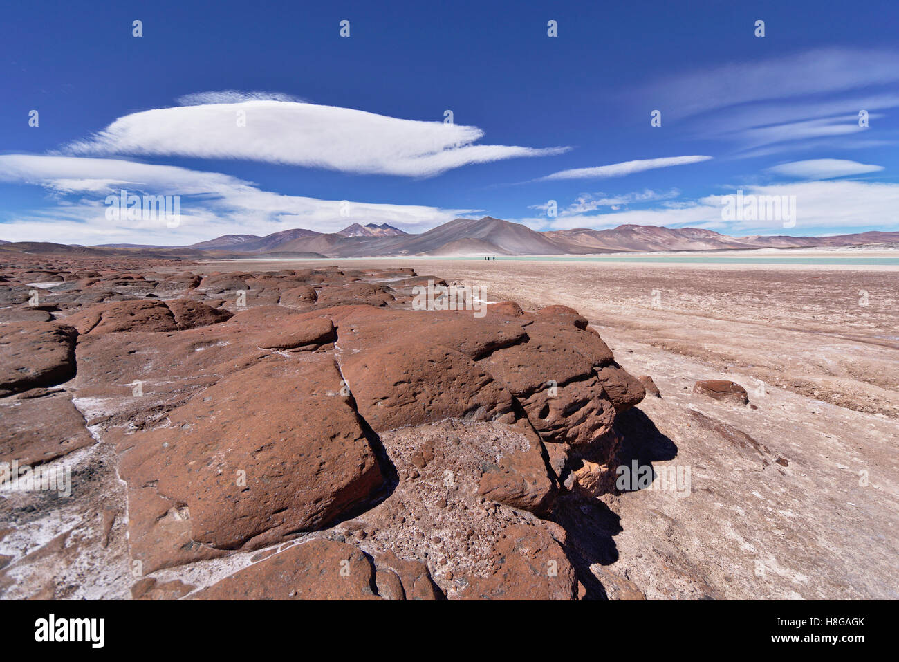 Underneath Red Rocks Red rocks under blue sky Stock Photo - Alamy
