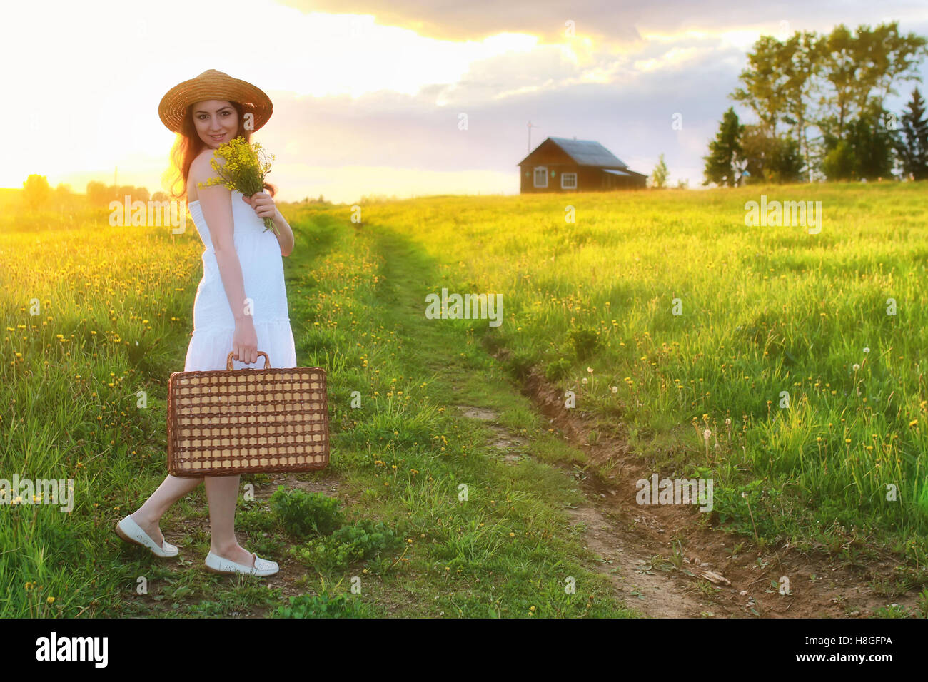 girl at sunset field Stock Photo - Alamy