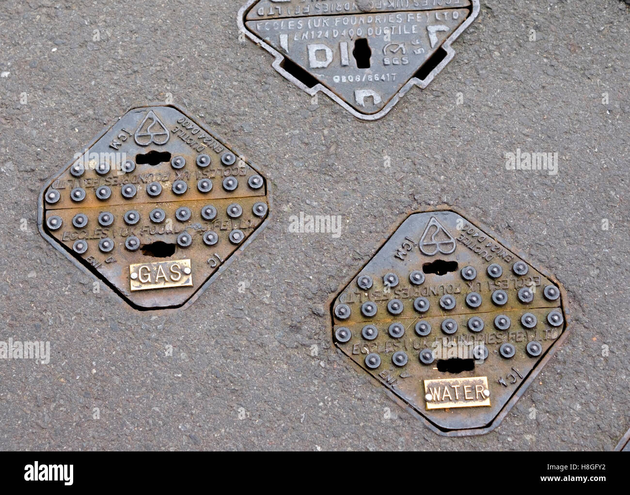 Gas and water utility inspection plates Stock Photo Alamy