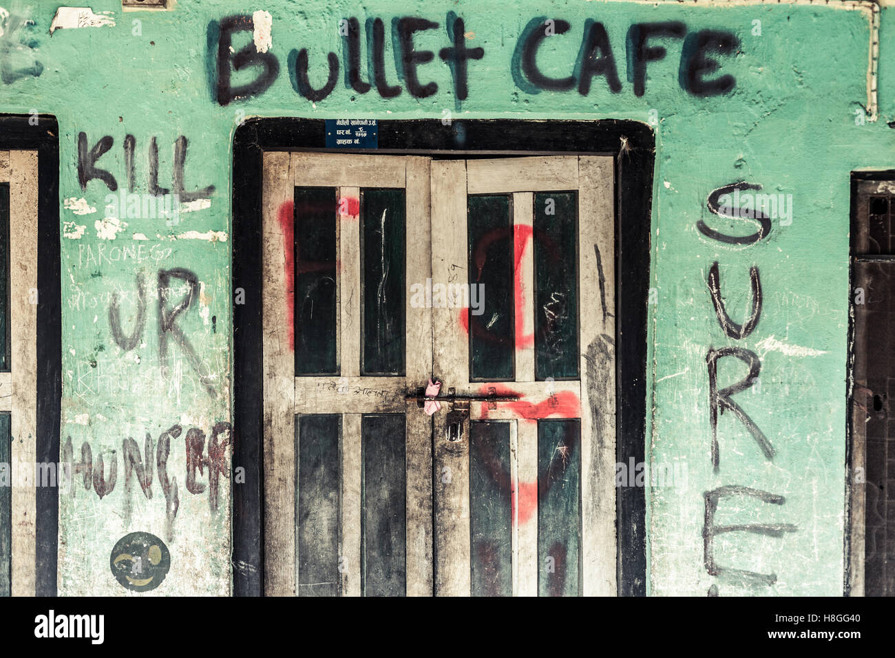 Bullet Cafe: Kill Ur Hunger graffiti, Chitwan, Nepal Stock Photo