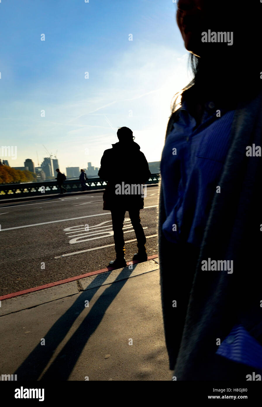 London, England, UK. People on Westminster Bridge in winter - silhouette Stock Photo