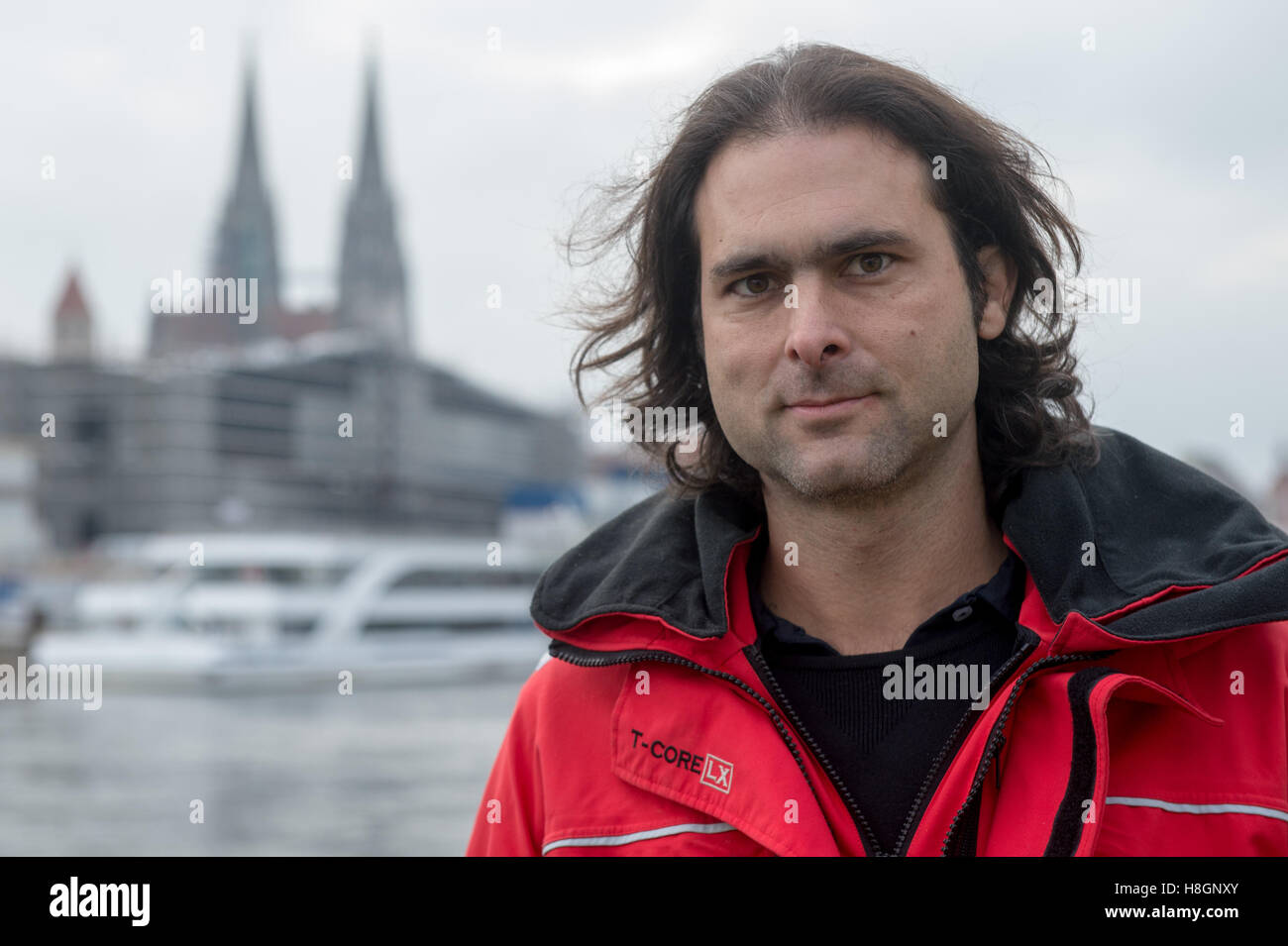 Regensburg, Germany. 12th Nov, 2016. The initatior of the refugee initiative 'Sea Eye, ' Michael Buschheuer, stands during a rescue drill on the Danube river in Regensburg, Germany, 12 November 2016. The organization reports that the German rescue ship 'Sea-Eye' saved more than 5,500 refugees from the Mediterranean Sea this year. Photo: ARMIN WEIGEL/dpa/Alamy Live News Stock Photo