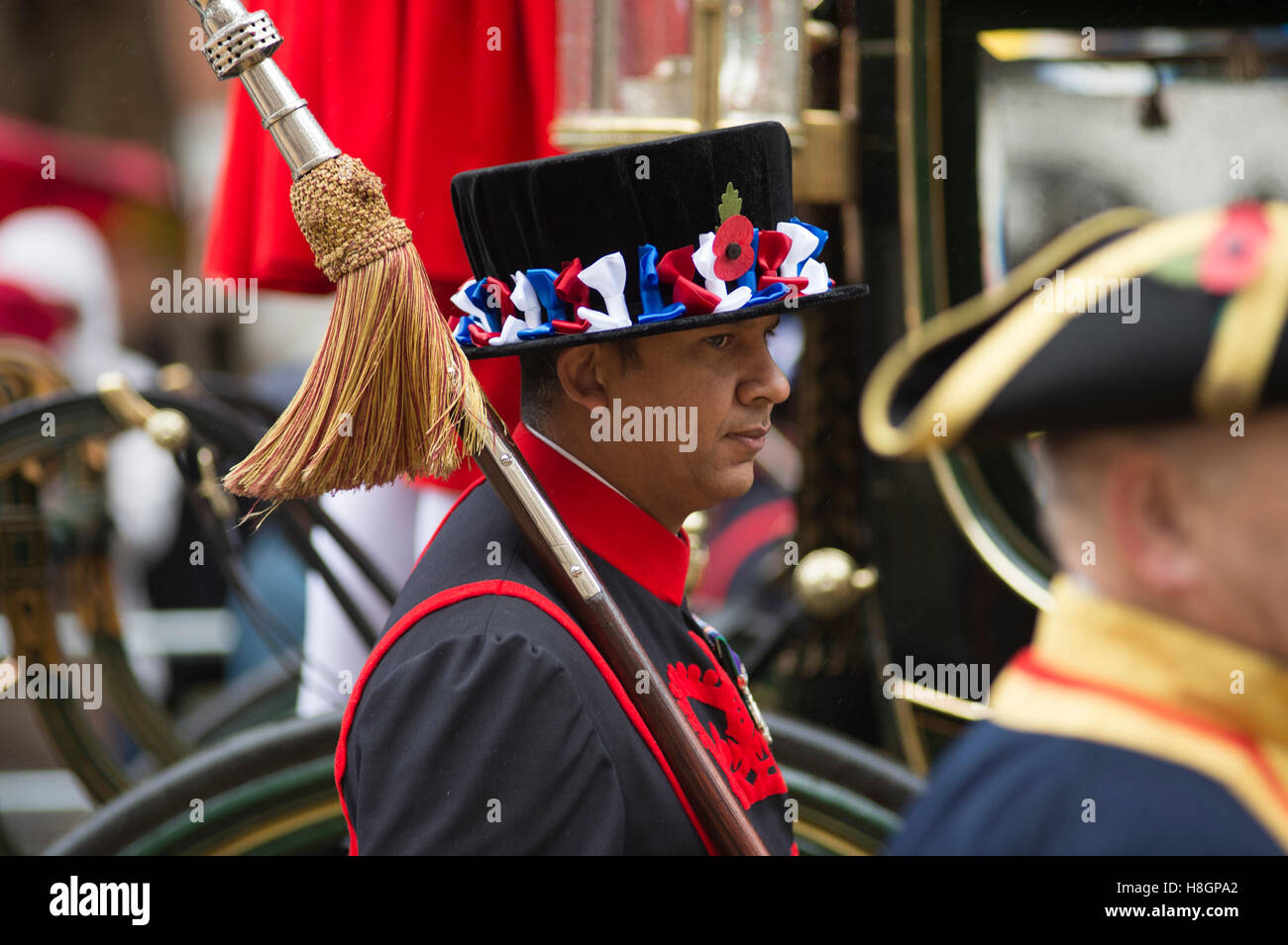 City of London, UK. 12th November, 2016. The world’s largest unrehearsed procession, The Lord Mayor’s Show, takes place through the City of London from the Guildhall to The Royal Courts of Justice on the Strand where Dr Andrew Parmley is sworn in on his first day in office. The ancient carnival is 801 years old this year and takes place in cold, wet weather in spite of which crowds line the route. Yeoman Warders escort the Late Lord Mayor. Credit: Malcolm Park editorial/Alamy Live News. Stock Photo