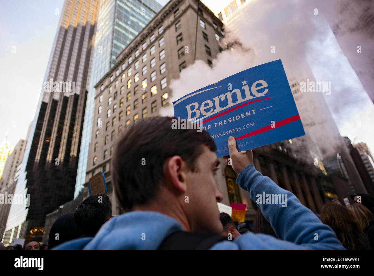 New York, USA. November 12, 2016. A man with a Bernie Sanders campaign sign was part of a protest outside the Trump Tower against the election of Donald Trump as the 45th U.S. president. Credit:  Joseph Reid/Alamy Live News Stock Photo