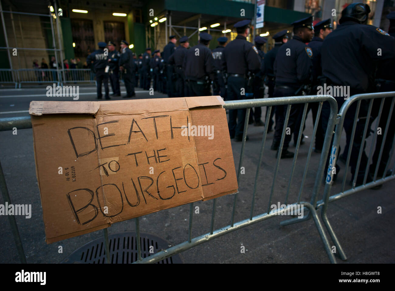 New York, USA. November 12, 2016. Sign reading 'death to the bourgeois' along route of march protesting against the election of Donald Trump as 45th president of the U.S. Credit:  Joseph Reid/Alamy Live News Stock Photo