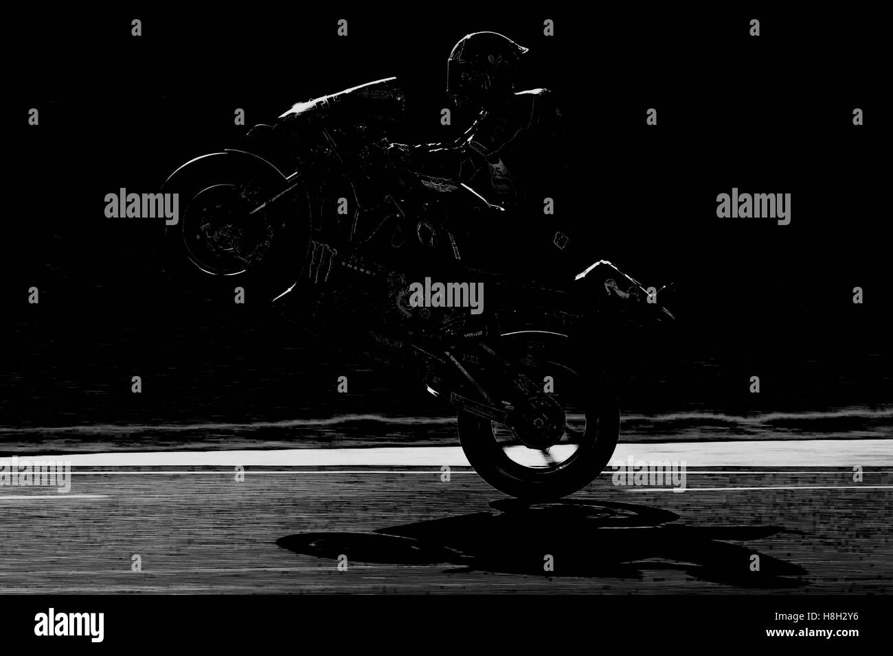 Valencia, Spain. 13th November, 2016.  Valentino Rossi of Italy and Movistar Yamaha MotoGP lifts the front wheel during the race the MotoGP of Valencia - Race at Comunitat Valenciana Ricardo Tormo Circuit on November 13, 2016 in Valencia, Spain..  Credit:  marco iorio/Alamy Live News Stock Photo