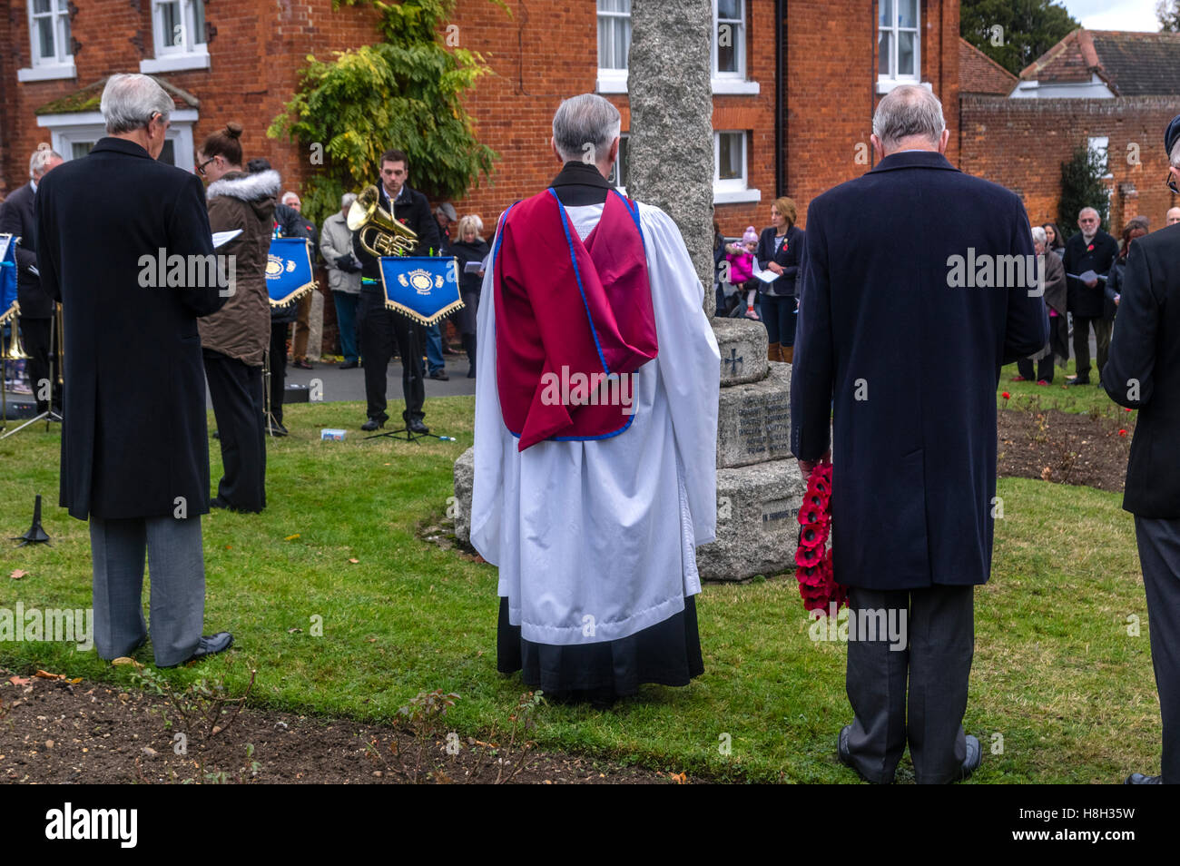 Great Bardfield Braintree Essex UK 13th November 2016.  The villagers and the village brass band are led in a service of remembrance at the village war memorial by the vicar of Great Bardfield the reverend doctor Robert Beaken to commemorate those village Credit:  William Edwards/Alamy Live News Stock Photo