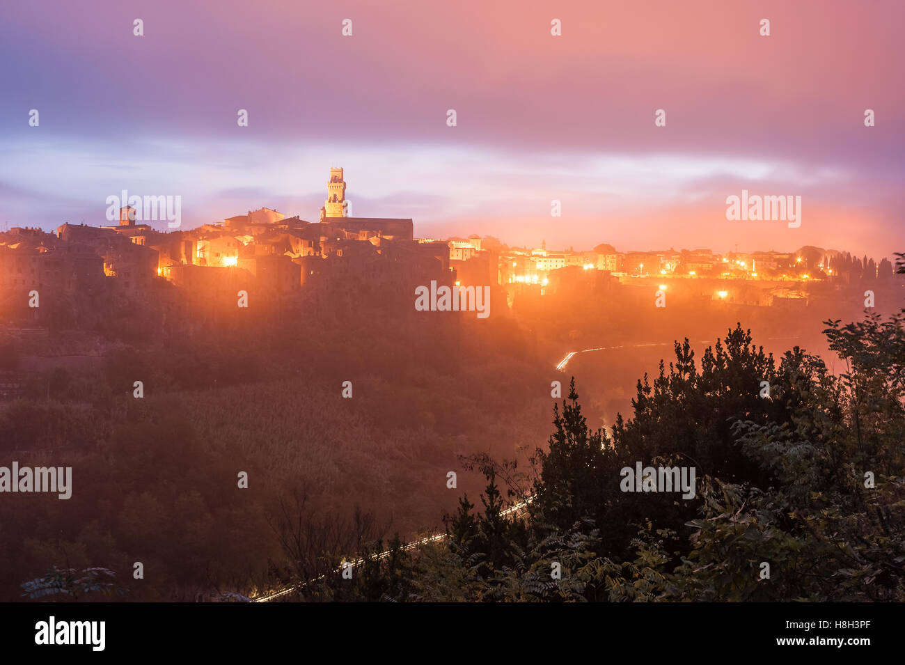 The ancient Etruscan town of Pitigliano at night in light of lanterns, landscape, Tuscany, Itali Stock Photo