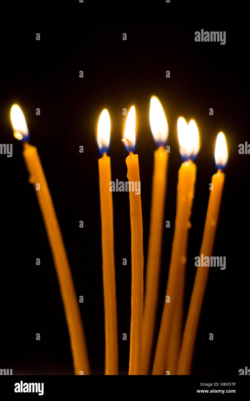 Burning candles in church closeup Stock Photo Alamy