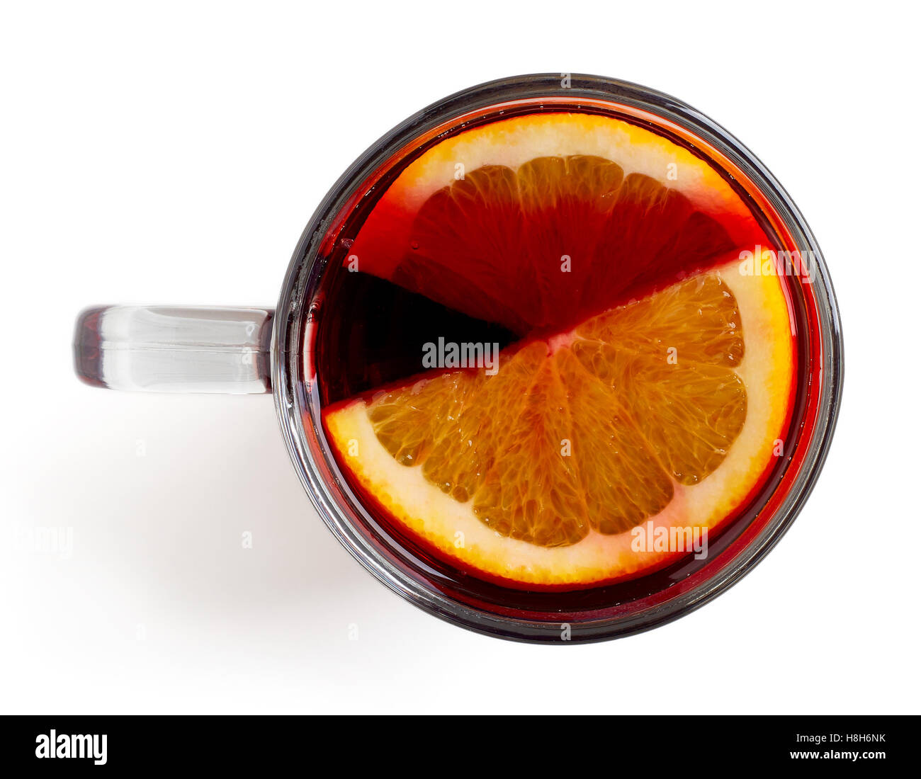 Hot red mulled wine with orange slice isolated on white background, top
