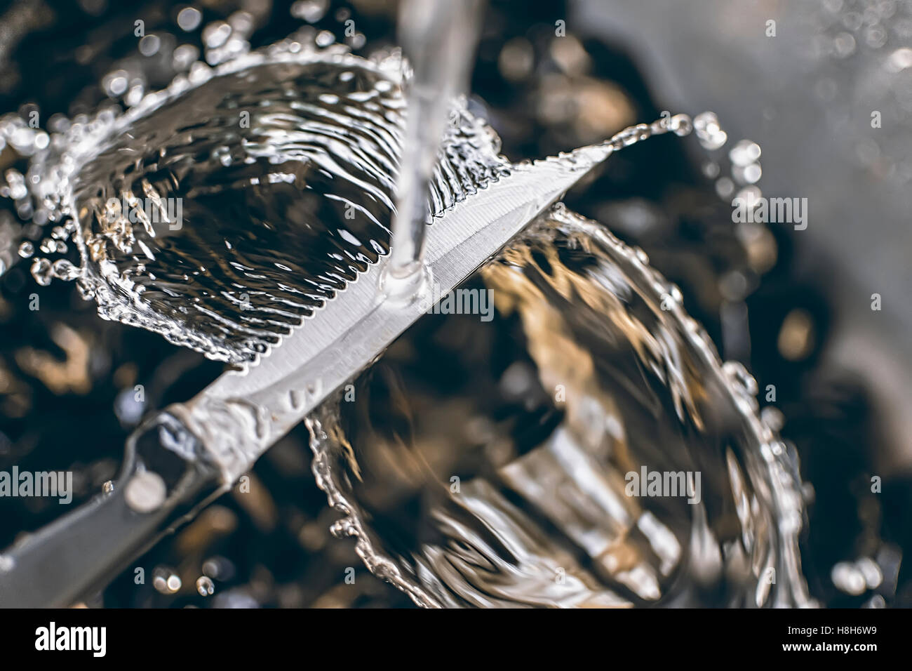 Knife Cleaning Under Running Water Stock Photo Alamy