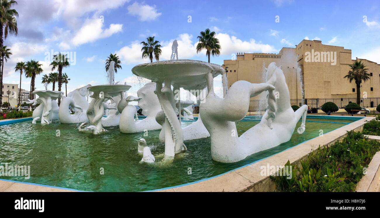 Sculpture of horse and swimming pool in front of National institute of music of Algiers. Pool and Institute is located near by old city Casbah. Stock Photo