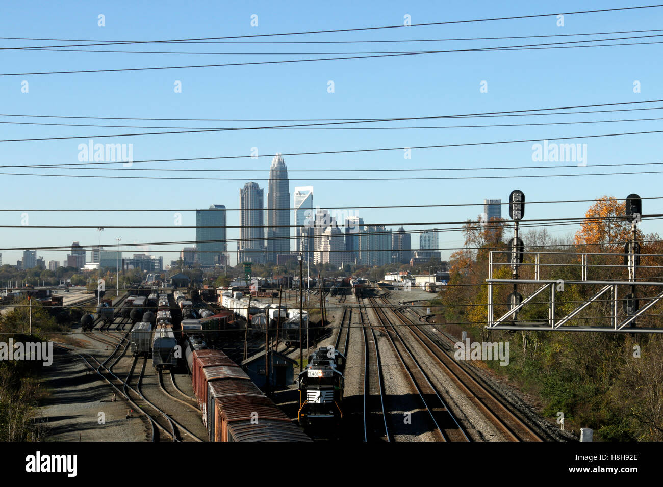 Rail yards near downtown Charlotte NC with uptown Charlotte in the background. Stock Photo
