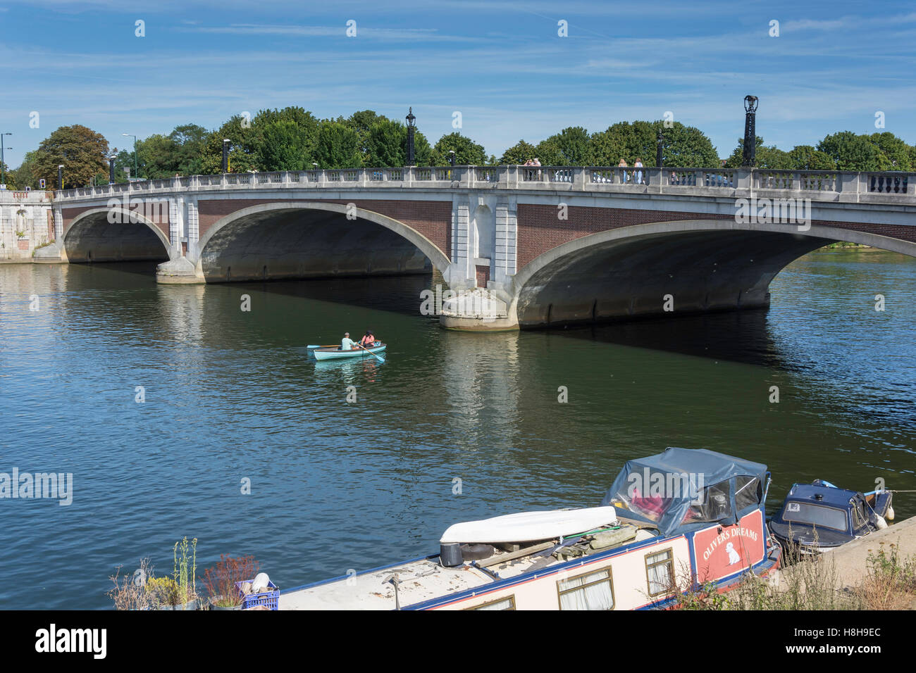 Hire boat by Hampton Court Bridge, River Thames, East Molesey, Surrey, England, United Kingdom Stock Photo