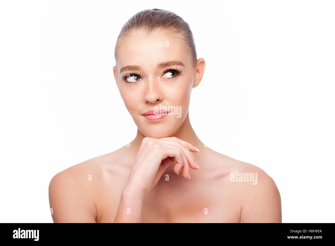 Beautiful clean face of woman looking to side, aesthetics exfoliating skincare concept, on white. Stock Photo