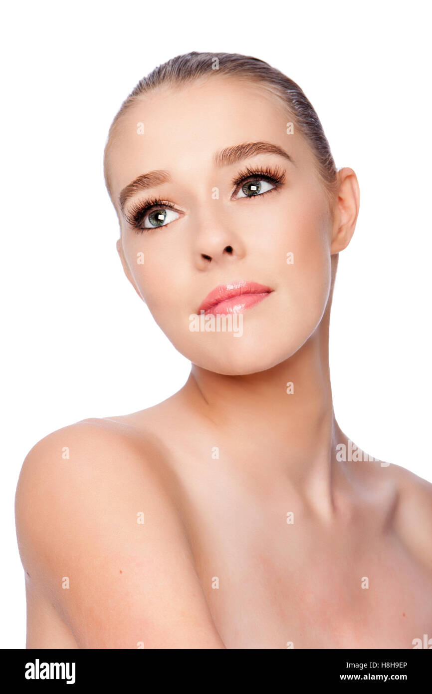 Beautiful clean face of woman looking up, aesthetics exfoliating skincare spa concept, on white. Stock Photo