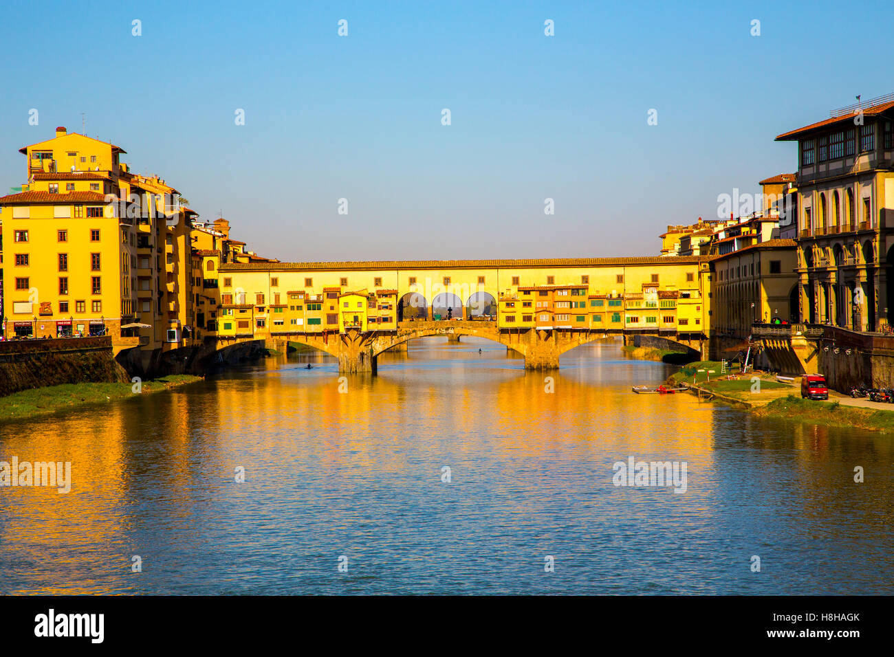 The Ponte Vecchio in Florence Italy in the early morning sun. Stock Photo