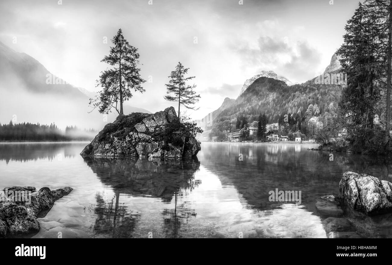 Black and white landscape with foggy lake and mountain, Hintersee, Ramsau Stock Photo