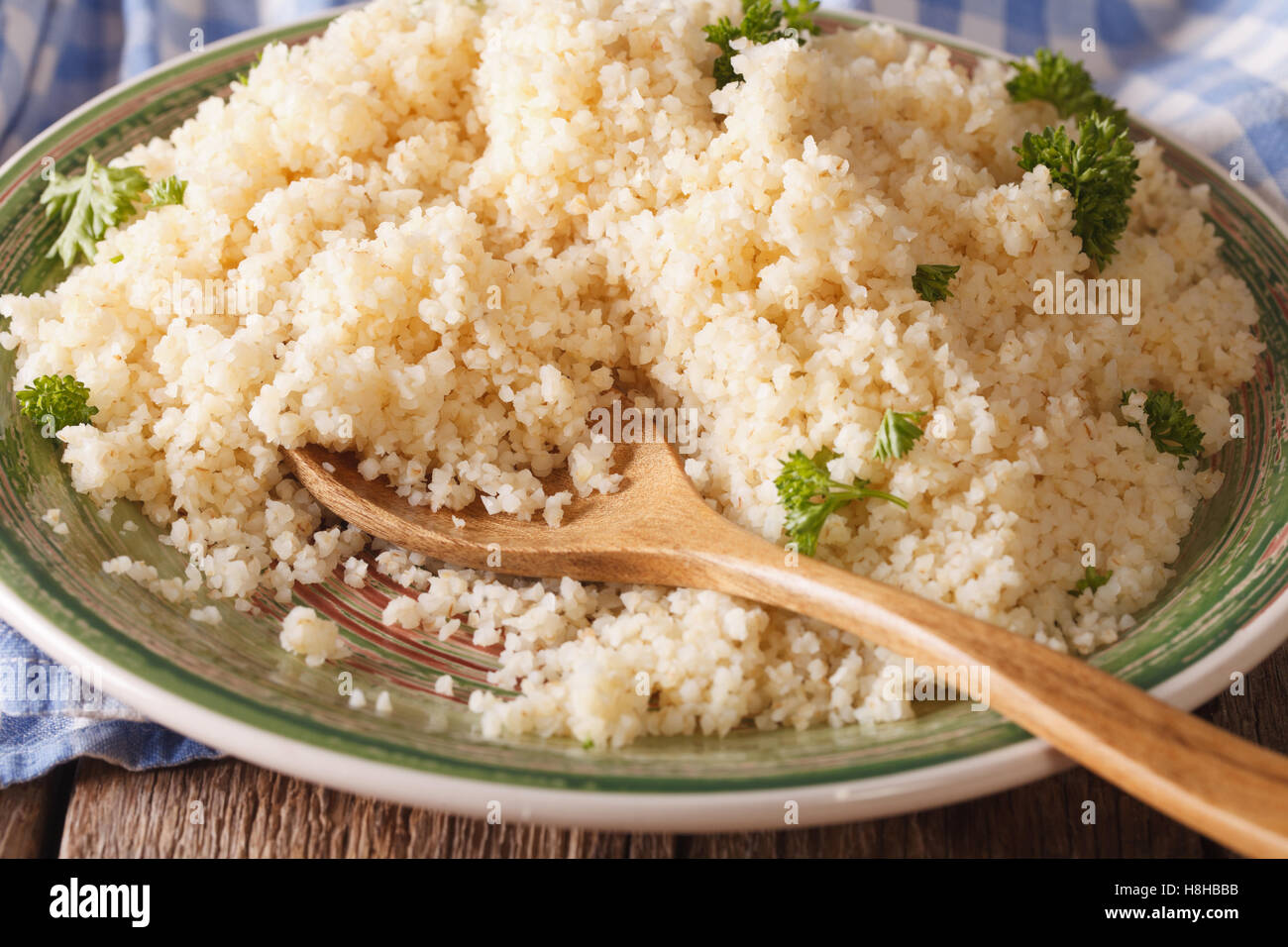 Cooked bulgur with herbs close-up on a plate. Horizontal Stock ...