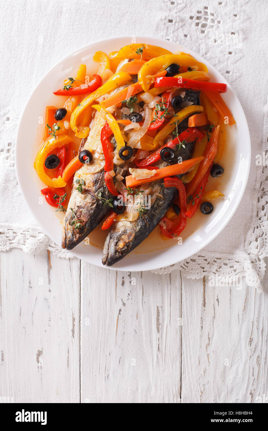 Mackerel in vegetable marinade closeup on a plate on the table