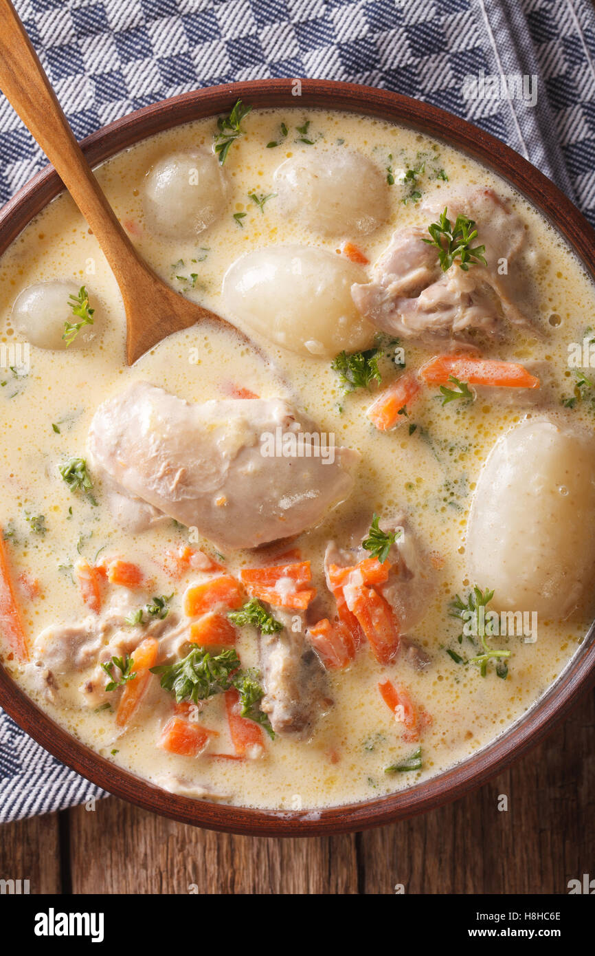 Belgian Ghent WATERZOOI soup with chicken close up in a bowl. Vertical view from above Stock Photo